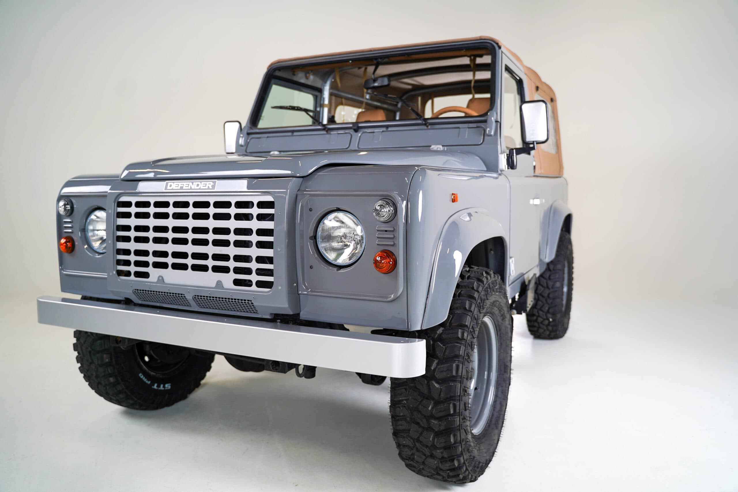 Grey Land Rover Defender 90 in studio
